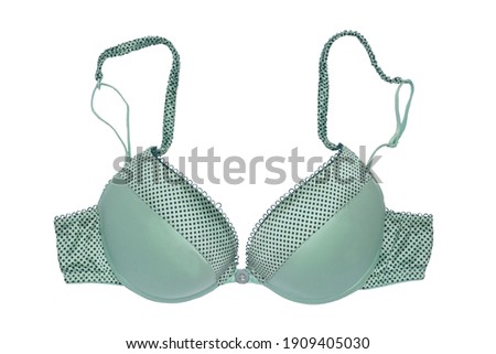 Bra isolated. Closeup of beautiful female stylish turquoise bra with straps and dots pattern isolated on a white background. Fashionable women underwear. Foto stock © 
