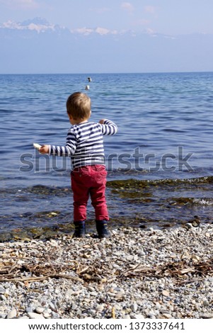 Throwing stones in the water has always been a child's pleasure (Lake of Geneva, Morges, Switzerland)                                Stock fotó © 