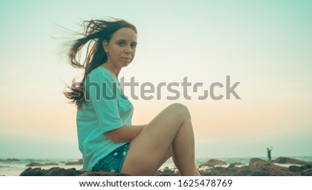 Similar – Image, Stock Photo Charming woman on stony coast