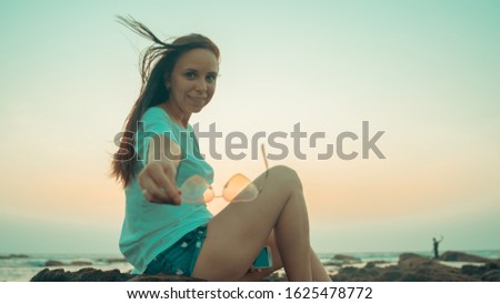Similar – Image, Stock Photo Charming woman on stony coast