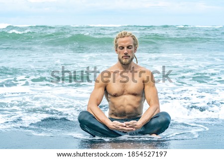 Similar – Image, Stock Photo Flexible young yogi man standing on beach