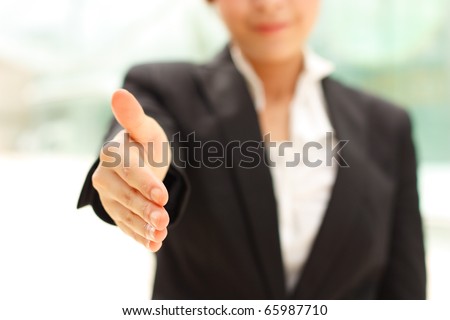 Business woman giving handshake