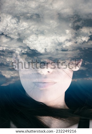 Dream like surreal double exposure portrait of attractive lady combined with aerial view photograph
