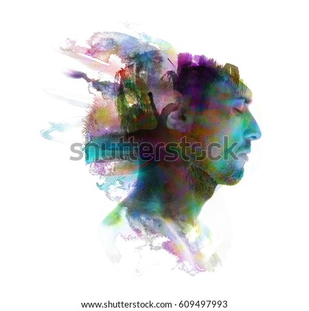 Profile portrait of a sexy man with a colourful painting dissolving behind him