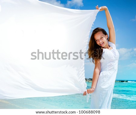 Beautiful Girl With White Scarf on The Beach. Travel and Vacation. Freedom Concept