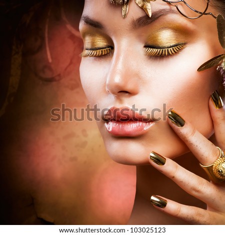 Gold Makeup.Fashion Girl Portrait
