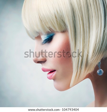 Haircut. Beautiful Girl with Healthy Short Blond Hair. Hairstyle