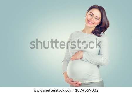 Similar – Image, Stock Photo Smiling pregnant woman touching belly on floor at home