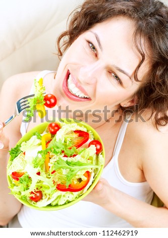 Dieting concept.Healthy Food.Diet.Beautiful Young Woman Eating Vegetable Salad