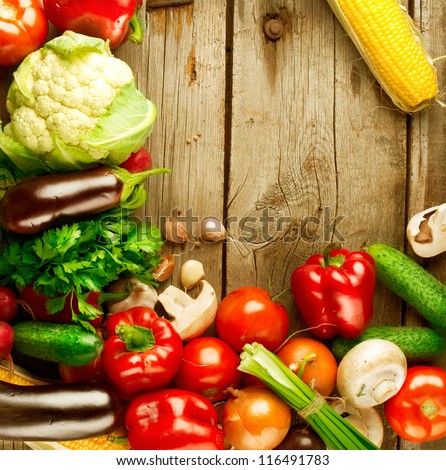 Healthy Organic Vegetables on a Wooden Background. Frame Design