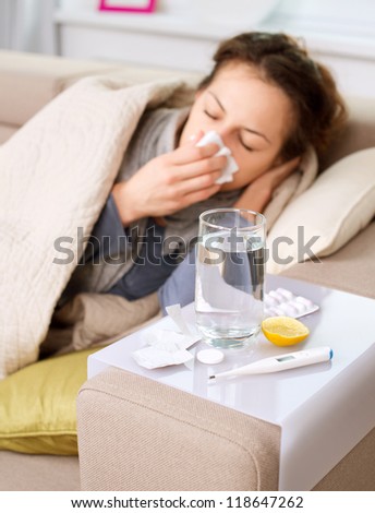 Sick Woman.Flu.Woman Caught Cold. Sneezing into Tissue. Headache. Virus .Medicines