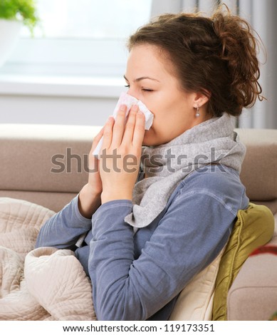 Sick Woman.Flu.Woman Caught Cold. Sneezing into Tissue. Headache. Virus