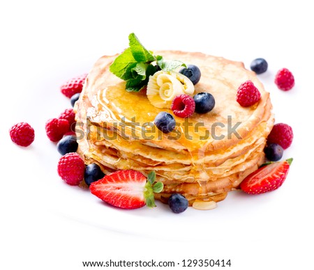 Pancake. Crepes With Berries. Pancakes stack with Strawberry, Raspberry, Blueberry and Syrupe isolated on a White Background