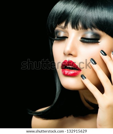 Fashion Woman Portrait. Stylish Model. Beauty Makeup and Manicure. Beautiful Girl with Black Hair, Smoky Eyes, Red Lipstick and Black Nails