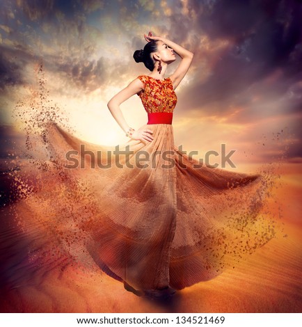 Dancing Fashion Woman wearing Blowing Long Chiffon Dress. Fashion Art Fantasy Collage. Sand Fairy