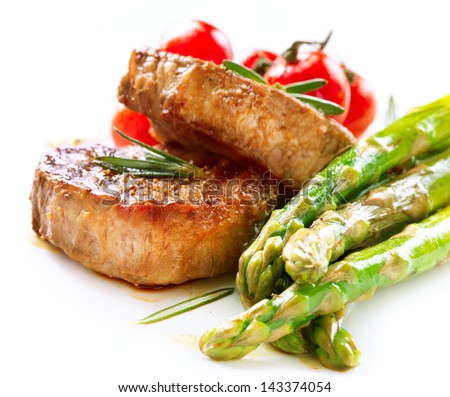 Grilled Beef Steak Meat with Asparagus and Cherry Tomato. Steak Dinner. Food. BBQ Grill. Berbeque