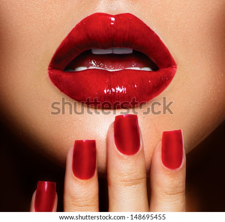 Red Sexy Lips and Nails closeup. Open Mouth. Manicure and Makeup. Make up concept. Kiss
