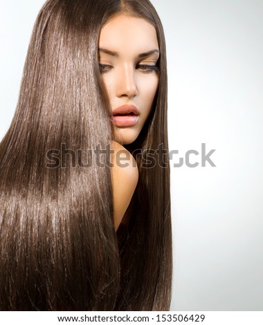Hair. Beauty Woman with Long Healthy and Shiny Smooth Brown Hair. Model Brunette Girl Portrait over white background. Hair Extensions