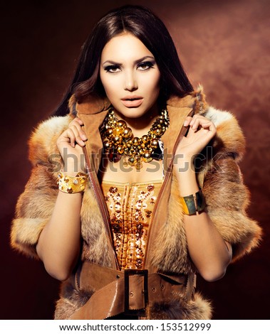 Beauty Fashion Model Girl in Fox Fur Coat. Beautiful Woman in Luxury Red Fur Jacket
