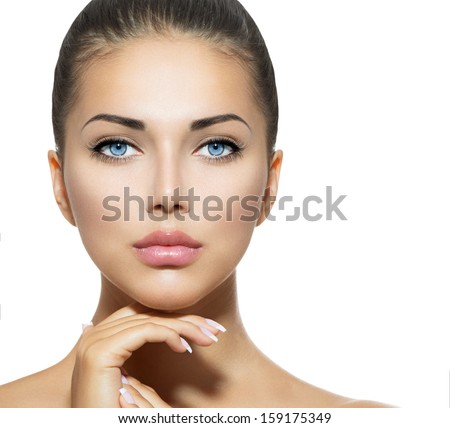 Beautiful Woman Face. Beauty Portrait. Beautiful Spa Woman Touching her Face. Perfect Fresh Skin. Pure Beauty Model Girl. Youth and Skin Care Concept. Brunette with Blue Eyes