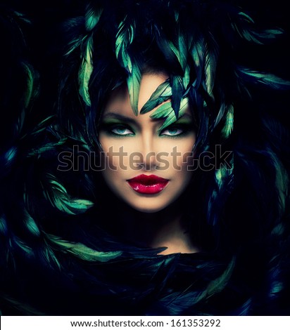 Mysterious Woman Portrait. Beautiful Model Woman Face Closeup. Feathers Hairstyle. Darkness.