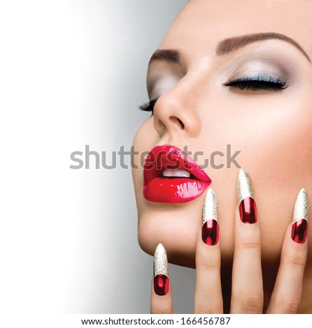 Fashion Beauty Model Girl. Manicure and Make-up. Nail art. Beautiful Woman With Red and Golden Nails and Luxury Makeup. Beautiful Girl Face and Hand