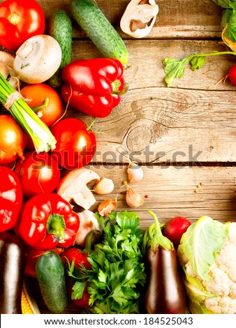 Healthy Organic Vegetables on a Wooden Background. Wood. Bio vegan food. Art Border Design