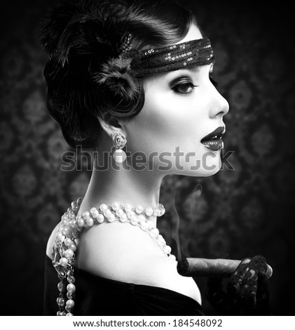 Retro Woman Portrait. Vintage Styled Girl With Cigar. Smoking Lady. Vintage Styled Black and White Photo. Old Fashioned Makeup and Finger Wave Hairstyle. 20\'s or 30\'s style.
