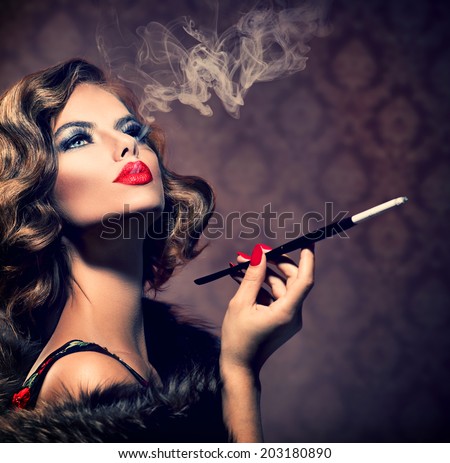 Beauty Retro Woman with Mouthpiece. Vintage Styled Beautiful Lady with cigarette. Smoking Model Girl Portrait. Hairstyle and Make up. Old Fashioned Makeup and Finger Wave Hairstyle. 20\'s or 30\'s style
