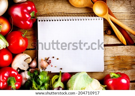 Fresh Organic Vegetables and Spices on a Wooden Background and Paper for Notes.Open Notebook and Fresh Vegetables Background. Diet. Dieting concept