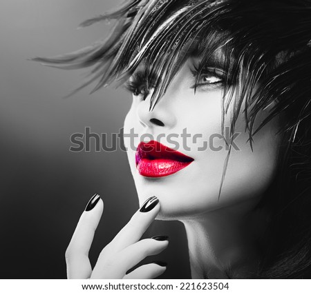 Fashion Art Portrait Of Beautiful Girl. Vogue Style Woman. Hairstyle. Black Hair and Nails, red lipstick. Isolated on Black Background. Beauty Stylish Model Portrait