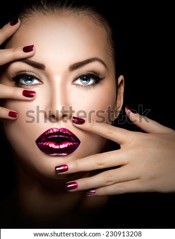Fashion model girl face, beauty woman make up and manicure. Makeup closeup, perfect skin, manicured nails, deep violet color. Smoky eyes holiday luxury make-up, blue eyes