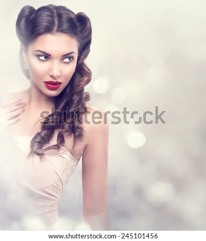Beauty fashion model retro girl over blinking background. Vintage style Woman Portrait. Luxury Lady with Holiday Magic background. Miracle Light. Copy Space