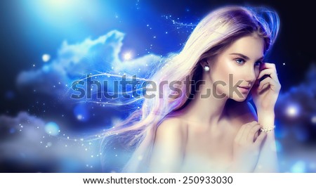Beauty fantasy girl with long blowing hair over night sky with stars. Fashion Model Portrait. Fairy Glamour Beautiful Woman with Healthy and Beauty Blonde Hair. Flying long hair
