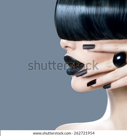 High Fashion Model Girl Portrait with Trendy Hair style, Black Make up and Manicure. Woman profile face. Long Black Glossy Fringe Hairstyle, Black Matte Nail Polish and Lipstick. Makeup. Haircut