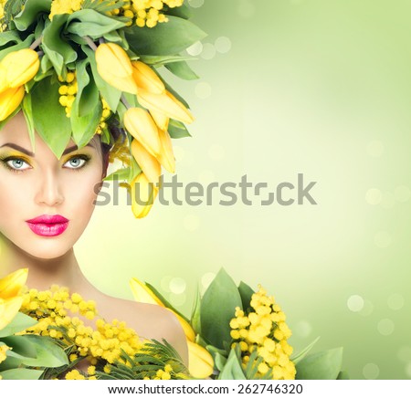 Spring woman. Beauty Spring model Girl with Flowers Hair Style. Beautiful lady with Blooming flowers on head. Nature Hairstyle. Summer. Holiday Creative Fashion Makeup. Make up. Vogue Style Portrait