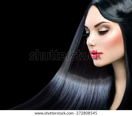 Beautiful model girl with healthy long straight shiny hair isolated on black background. Hair. Healthy Long Black Hair. Beauty Brunette Woman. Gorgeous Hair