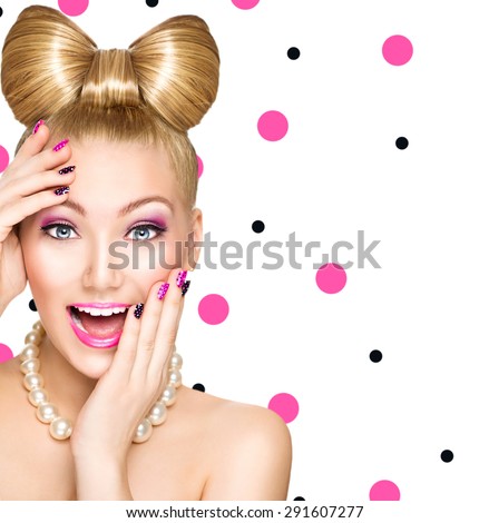 Beauty fashion happy surprised model girl with funny bow hairstyle, pink nail art and makeup isolated on white background with polka dots. Laughing retro styled young woman. Emotions