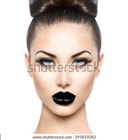 High Fashion Beauty Model Girl with Black Make up and Long Lushes. Black Lips. Dark Lipstick and White Skin. Vogue Style Portrait isolated on white background