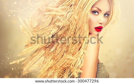 Beauty Fashion model girl with gold long wheat ears hair. Beautiful Fashion art portrait of young sexy blonde woman with wheat hairstyle. Organic cosmetic products for healthy hair concept