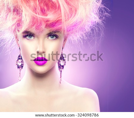 High Fashion Model Girl with pink color Updo hairstyle and bright make up. Beauty woman with glamour hairdo hair style, stylish makeup and accessories. Beauty Lady portrait