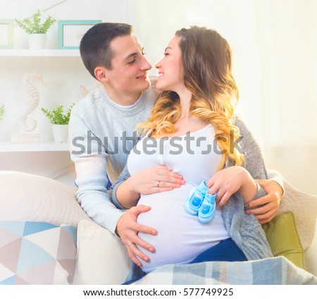 https://image.shutterstock.com/display_pic_with_logo/195826/577749925/stock-photo-happy-young-couple-expecting-baby-beautiful-pregnant-woman-and-her-husband-together-caressing-her-577749925.jpg