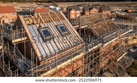 Similar – Image, Stock Photo Supported wooden beam, above which a window lets light into the building site.