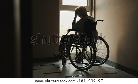lonely senior woman looking through the window of the nursing home. Mental health affected during the quarantine. High quality photo Stock foto © 