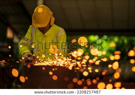 Similar – Image, Stock Photo Industrial worker using angle grinder grinding metal on welding seams. Worker working with angle grinder and has sparks. Tool for cut steel. Safety in industrial workplace. Metal factory industry.