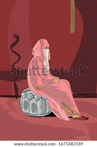 Moroccan woman wearing the veil and jellaba. A Moroccan woman sits on traditional Moroccan furniture