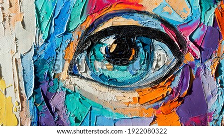 Oil portrait painting in multicolored tones. Abstract picture of a beautiful girl. Conceptual closeup of an oil painting and palette knife on canvas.