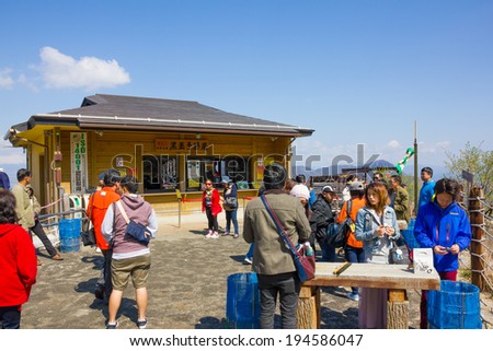 HAKONE -APR 23:Tourists buy the signature Black-boiled egg from the shop at Owakudani hot spring area in Hakone, Japan on 23th April 2014.Owakudani is the tourist attactive area in Fuji volcanic zone.