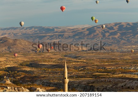 Nevsehir/Turkey - 23.10.2012 : Every morning in Cappadocia thousands of balloons start to fly simultaneously.Tourists in the basket can see Cappadocia from the air with the first light of the day.