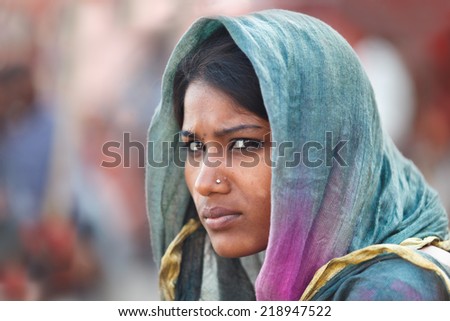 VARANASI, INDIA - 22/03/2013 : Unidentified young indian woman  with her colorful scarf.Scarf  made of indian silk is very common and popular among Indian woman,.